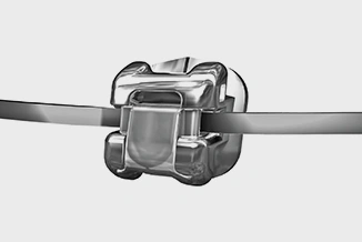 Orthodontic bracket and wire component mounted on horizontal wire against neutral background.