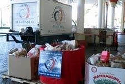 Orthodontic office reception area with donation bins and charity collection containers for patients.