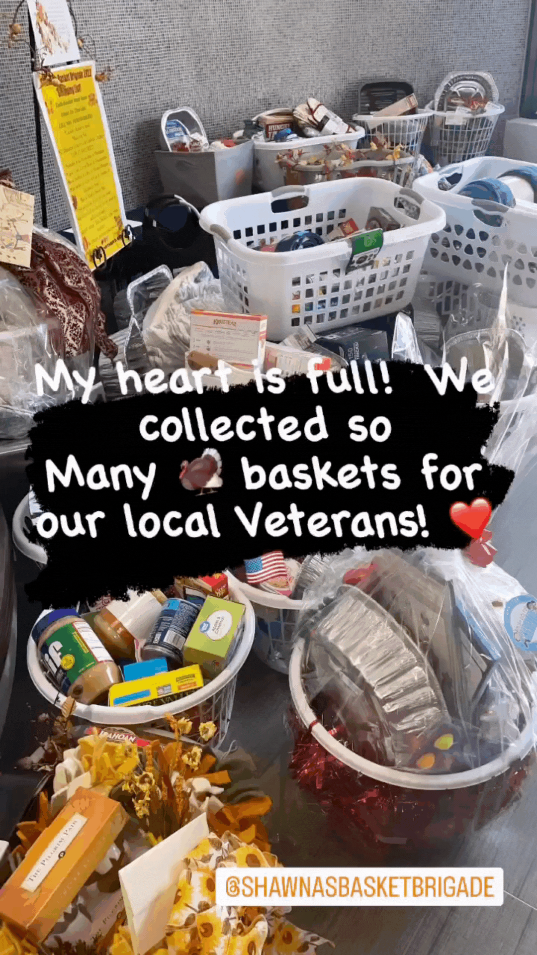Person displaying collected baskets and items for local veterans donation drive.